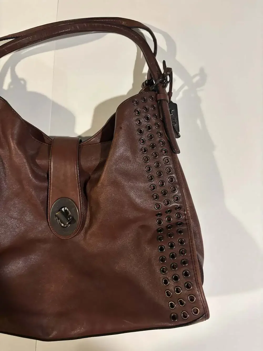 Coach Brown Leather Hobo Shoulder Bag with Grommets and Turnlock Closure
